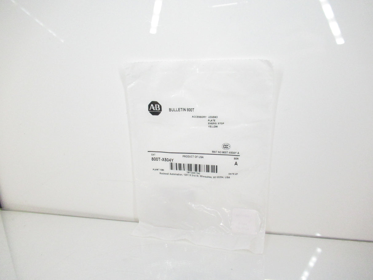 Allen Bradley 800T-X504Y Standard Yellow Legend Plate, Emerg. Stop, Surplus